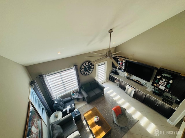 tiled living area with ceiling fan, plenty of natural light, and lofted ceiling