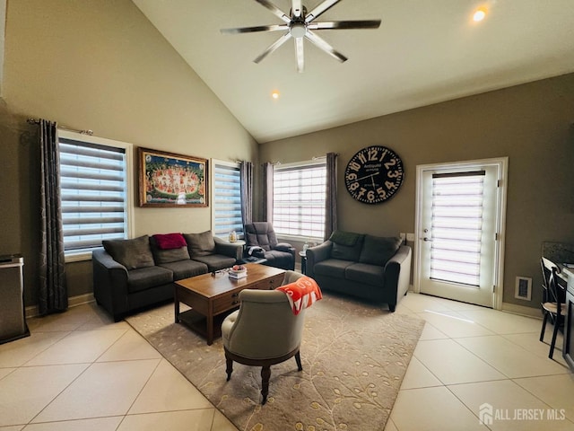 living room with high vaulted ceiling, a ceiling fan, baseboards, light tile patterned floors, and visible vents