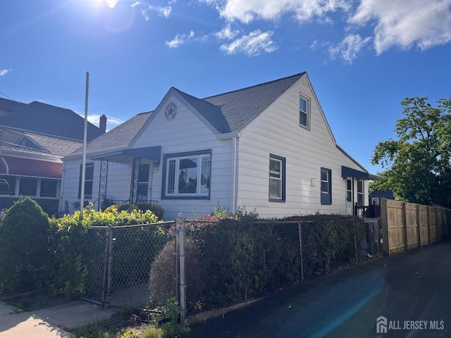 341 David St, South Amboy, NJ 08879 - view of side of property featuring a shingled roof and a gate