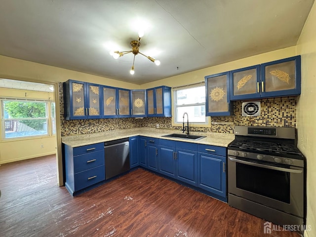341 David St, South Amboy, NJ 08879 - kitchen with stainless steel appliances, blue cabinetry, light countertops, decorative backsplash, and dark wood finished floors