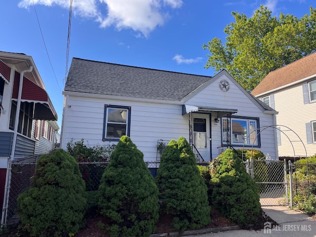 341 David St, South Amboy, NJ 08879 - view of front facade with a shingled roof and a gate
