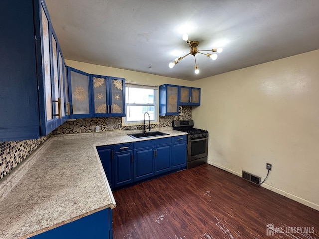 341 David St, South Amboy, NJ 08879 - kitchen with stainless steel range with gas cooktop, blue cabinetry, tasteful backsplash, and light countertops