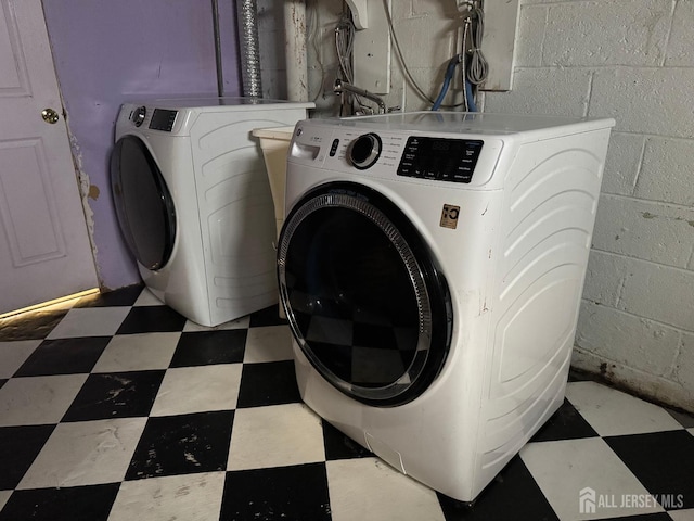 341 David St, South Amboy, NJ 08879 - laundry room featuring tile patterned floors, independent washer and dryer, and concrete block wall