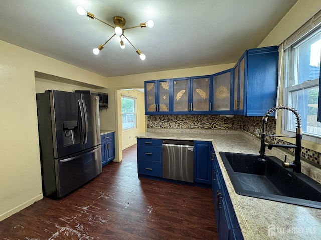 341 David St, South Amboy, NJ 08879 - kitchen with appliances with stainless steel finishes, blue cabinets, light countertops, and tasteful backsplash