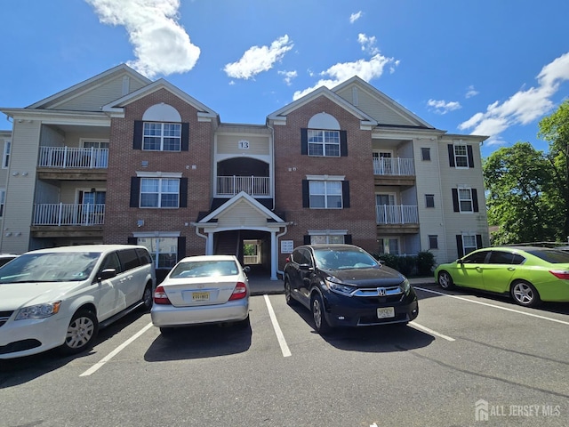 1338 Fernwood Ct, New Brunswick, NJ 08901 - view of building exterior featuring uncovered parking