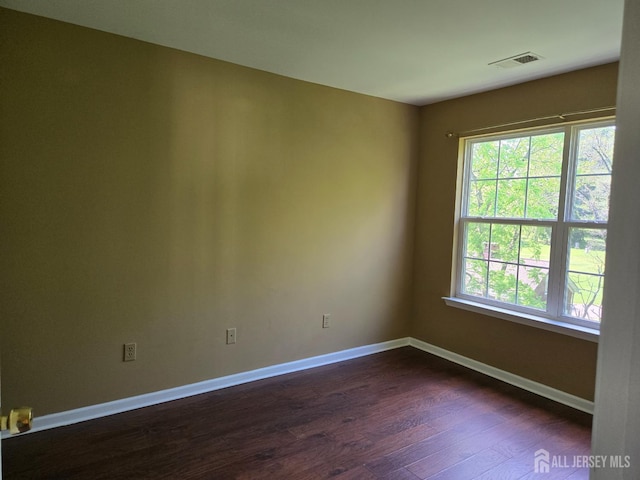 1338 Fernwood Ct, New Brunswick, NJ 08901 - unfurnished room with dark wood finished floors and baseboards