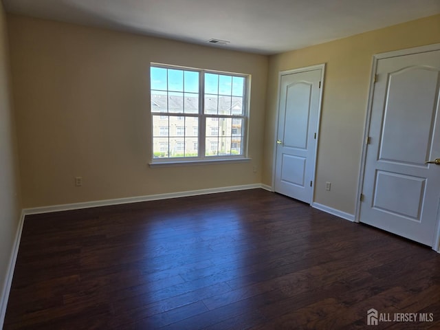 1338 Fernwood Ct, New Brunswick, NJ 08901 - unfurnished bedroom with dark wood finished floors and baseboards