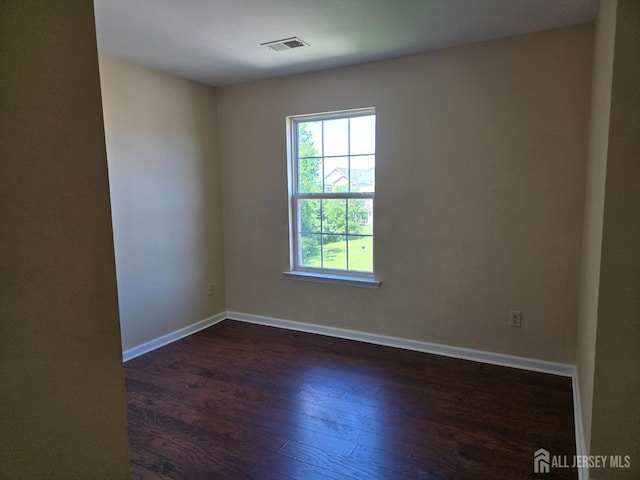 1338 Fernwood Ct, New Brunswick, NJ 08901 - unfurnished room with dark wood-type flooring and baseboards