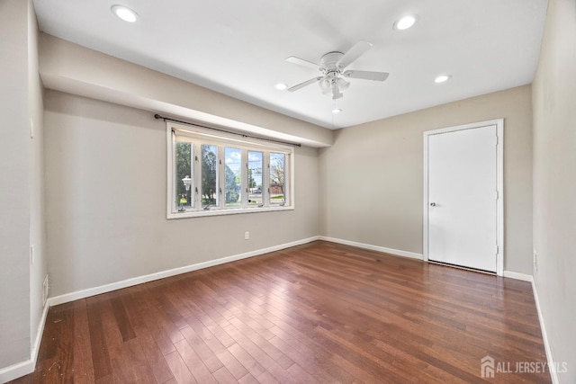 empty room featuring ceiling fan, recessed lighting, wood finished floors, and baseboards