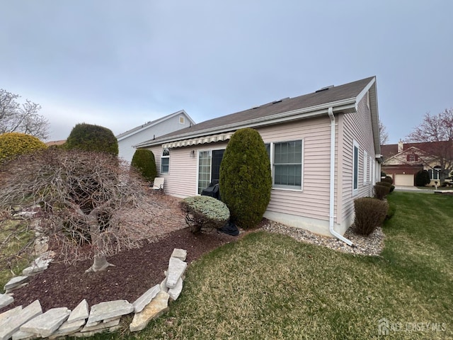46 Dawson Ln, Monroe, NJ 08831 - view of home's exterior with a lawn