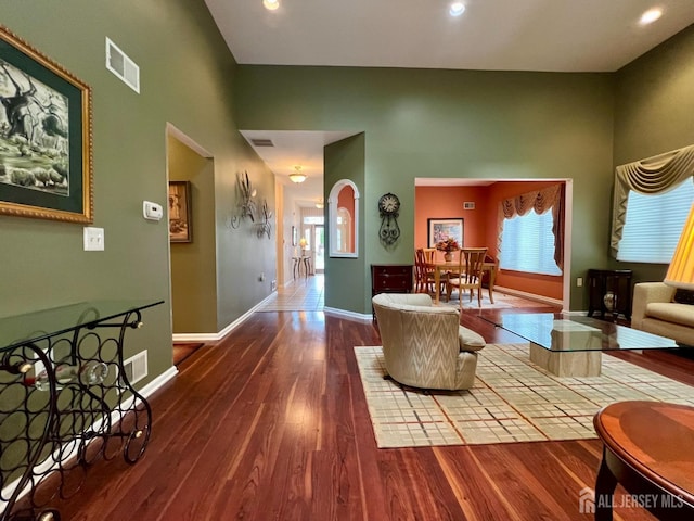 46 Dawson Ln, Monroe, NJ 08831 - living area featuring arched walkways, baseboards, wood finished floors, and visible vents