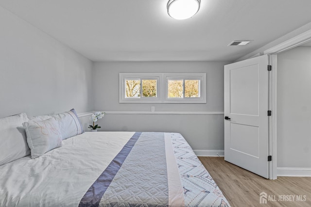 bedroom with light hardwood / wood-style floors