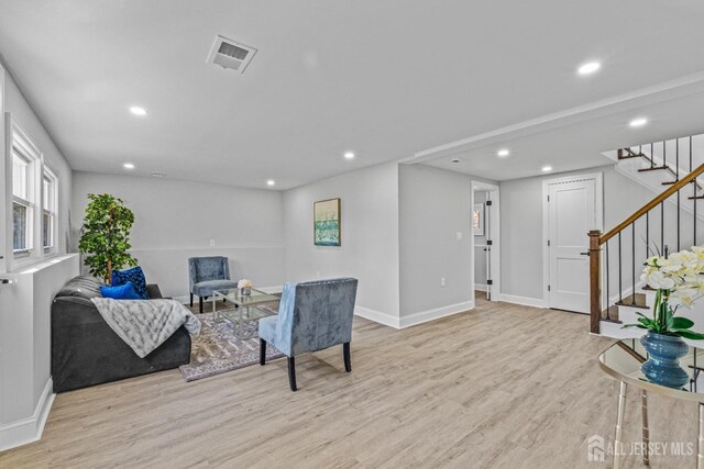 sitting room featuring light hardwood / wood-style floors