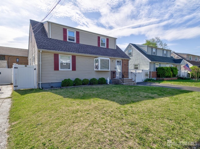 7 Kenneth Ave, Sayreville, NJ 08859 - view of front facade with a gate and roof with shingles