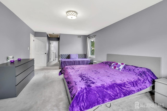 bedroom with light carpet