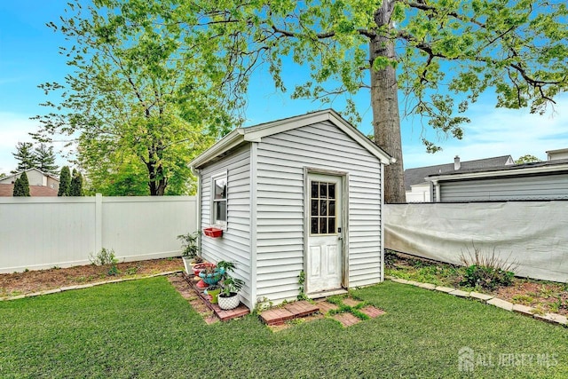 view of shed with a fenced backyard