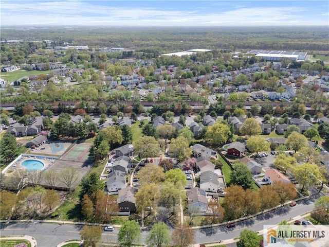 aerial view of property's location with nearby suburban area