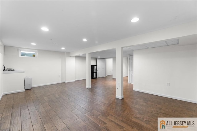 basement featuring wood finished floors, recessed lighting, and baseboards