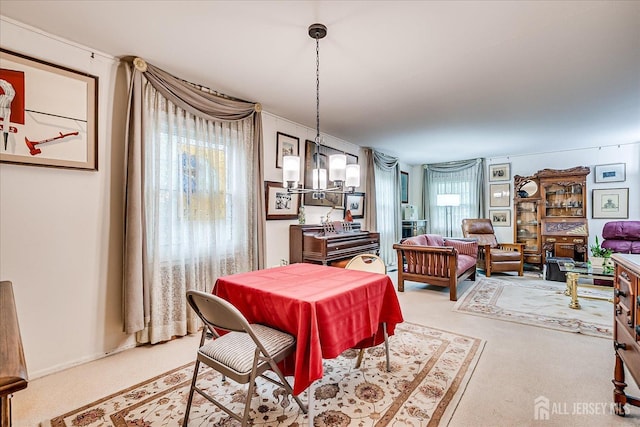 27 Landry Rd, Franklin Twsp, NJ 08873 - carpeted dining space with a chandelier