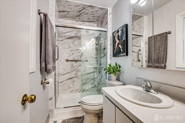27 Landry Rd, Franklin Twsp, NJ 08873 - bathroom with a marble finish shower, vanity, toilet, and tile patterned flooring