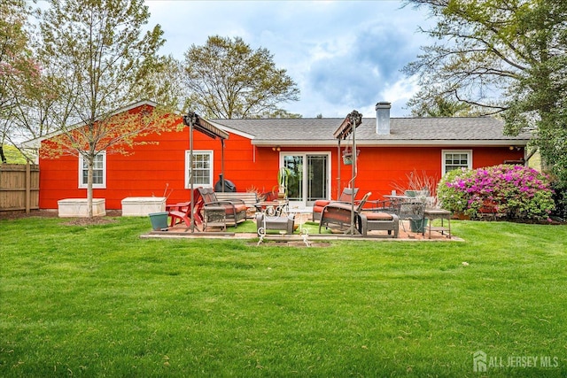 27 Landry Rd, Franklin Twsp, NJ 08873 - rear view of house with a chimney and a patio