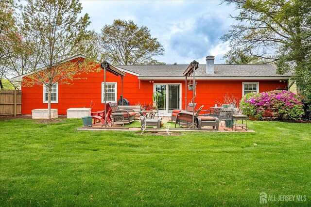 27 Landry Rd, Franklin Twsp, NJ 08873 - back of property with a chimney and a patio