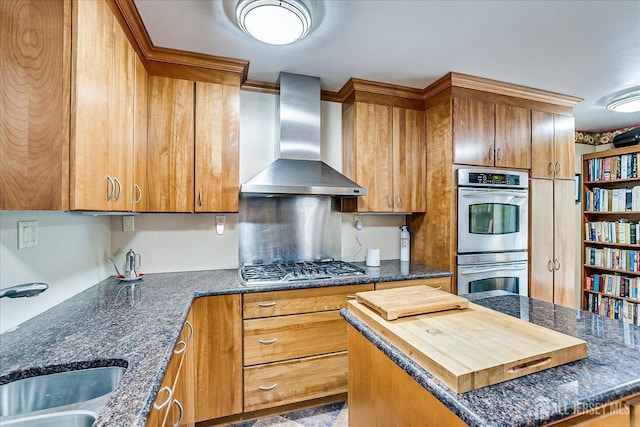 27 Landry Rd, Franklin Twsp, NJ 08873 - kitchen featuring stainless steel double oven, wall chimney range hood, a center island, a sink, and brown cabinets
