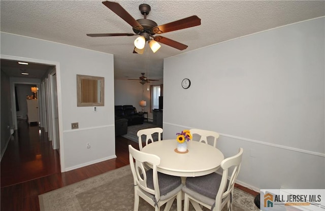 176 Rossmoor Dr Unit C, Monroe, NJ 08831 - dining room with wood finished floors, ceiling fan, a textured ceiling, and baseboards