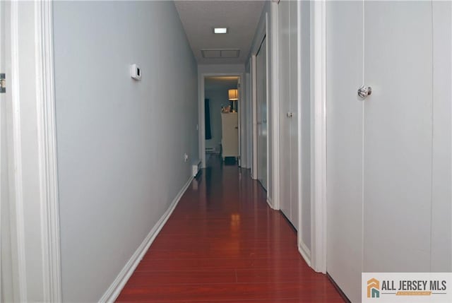176 Rossmoor Dr Unit C, Monroe, NJ 08831 - corridor with wood finished floors and baseboards