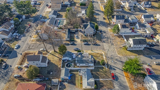 birds eye view of property with a residential view