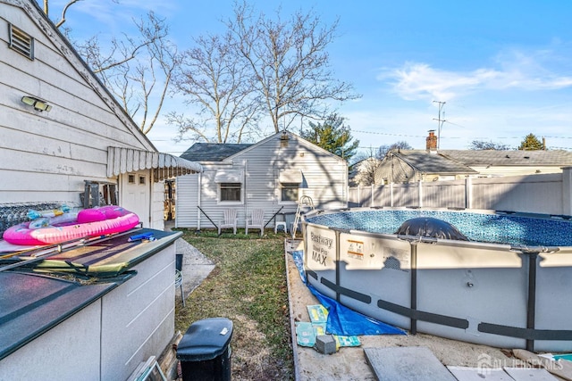 view of yard with a fenced in pool and fence