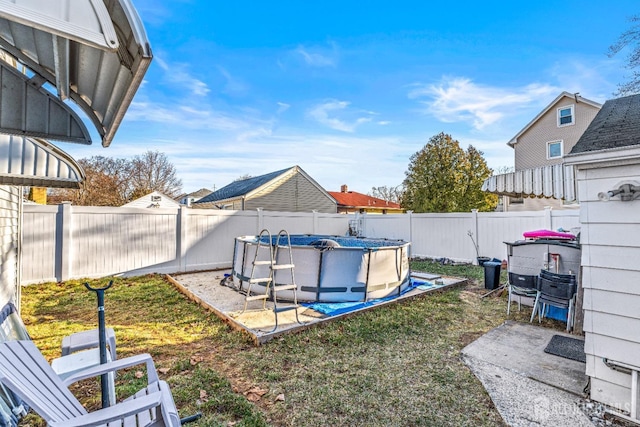 view of yard with a fenced in pool and a fenced backyard