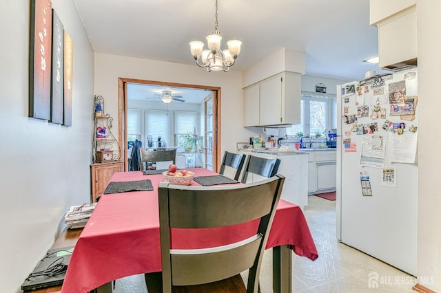 dining area featuring a chandelier and ceiling fan
