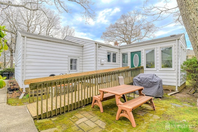 back of house with a wooden deck