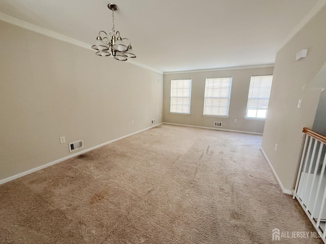 unfurnished room with visible vents, light colored carpet, baseboards, and ornamental molding