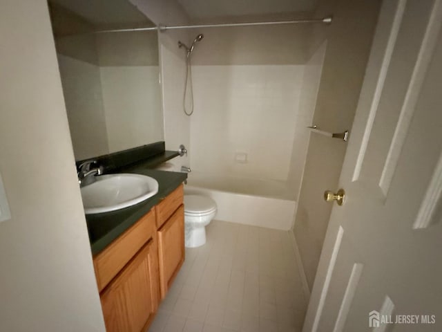 bathroom with tile patterned floors, vanity, and toilet