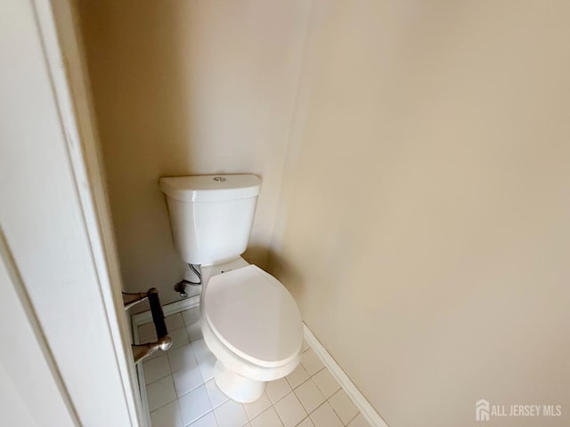 bathroom with tile patterned floors and toilet