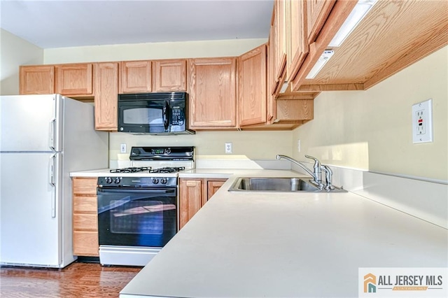 kitchen with white appliances, dark hardwood / wood-style flooring, sink, and light brown cabinets