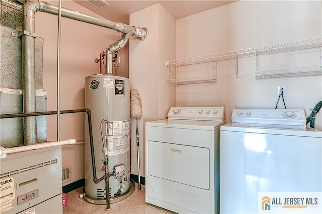 washroom featuring separate washer and dryer and gas water heater