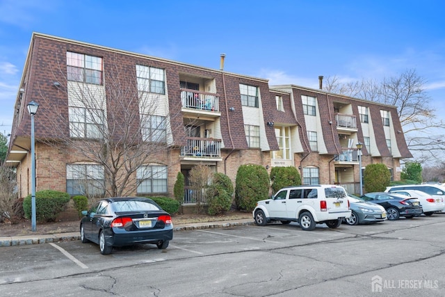 1006 Hidden Village Dr, Perth Amboy, NJ 08861 - view of apartment building / complex featuring uncovered parking