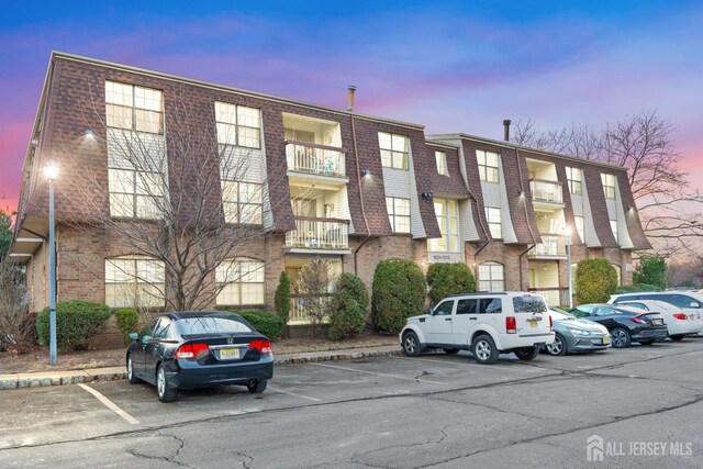 1006 Hidden Village Dr, Perth Amboy, NJ 08861 - view of building exterior featuring uncovered parking