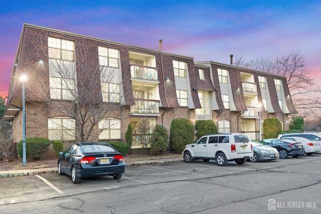 1006 Hidden Village Dr, Perth Amboy, NJ 08861 - view of building exterior with uncovered parking