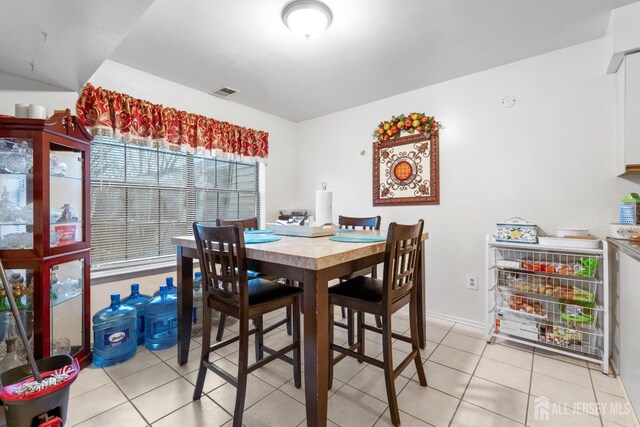 dining room featuring light tile patterned flooring