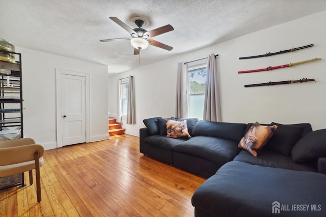 373 Rushmore Ave, Piscataway, NJ 08854 - living room with a ceiling fan, a textured ceiling, light wood finished floors, and stairway