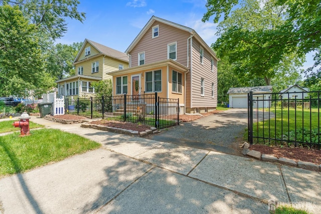 373 Rushmore Ave, Piscataway, NJ 08854 - view of front facade with an outbuilding and a detached garage