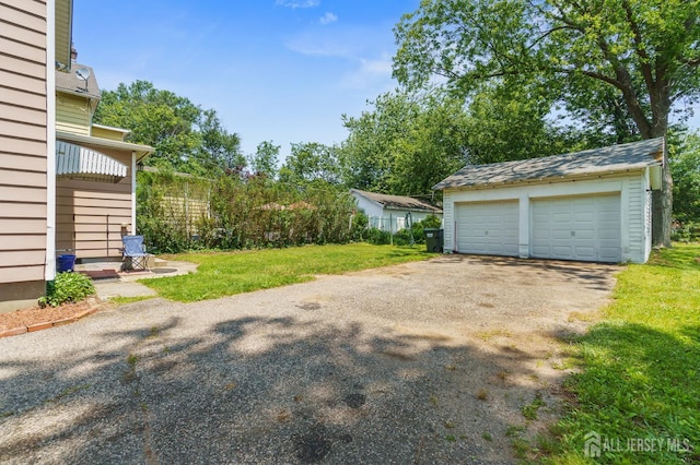 373 Rushmore Ave, Piscataway, NJ 08854 - view of grassy yard with an outbuilding and a garage