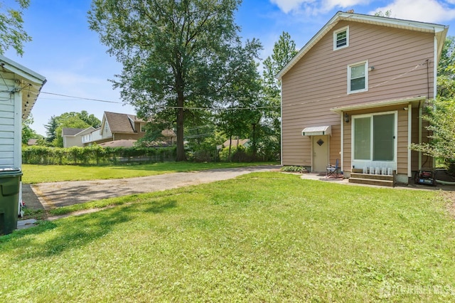 373 Rushmore Ave, Piscataway, NJ 08854 - rear view of house featuring a lawn and entry steps