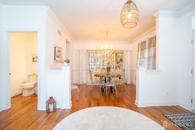 105 Recklesstown Way, Chesterfield, NJ 08515 - dining area featuring an inviting chandelier, ornamental molding, wood finished floors, and visible vents