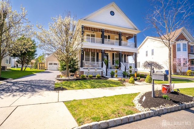 105 Recklesstown Way, Chesterfield, NJ 08515 - view of front of home featuring a balcony, covered porch, a front yard, and a detached garage