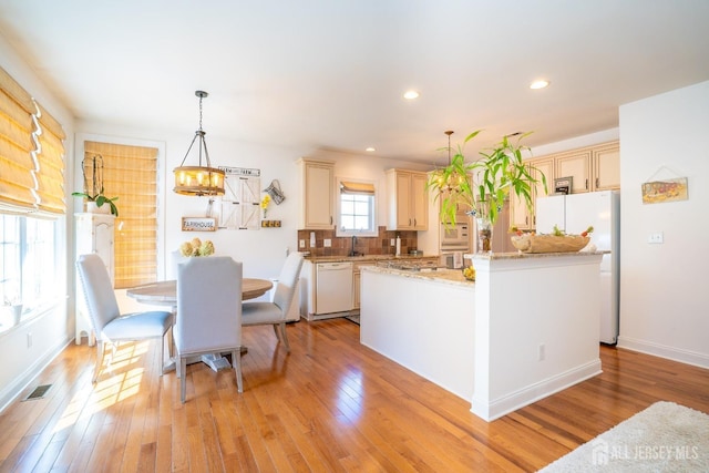 105 Recklesstown Way, Chesterfield, NJ 08515 - kitchen with light wood-type flooring, a kitchen island, white appliances, and visible vents
